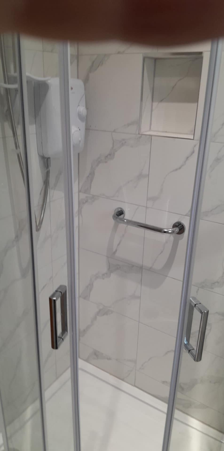 Shower enclosure and electric shower